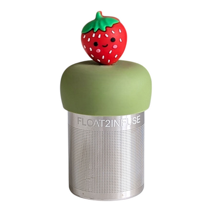 red smiling strawberry tea infuser for loose leaf tea with a fine mesh stainless steel tea strainer that reads FLOAT2INFUSE on a green base with a white background
