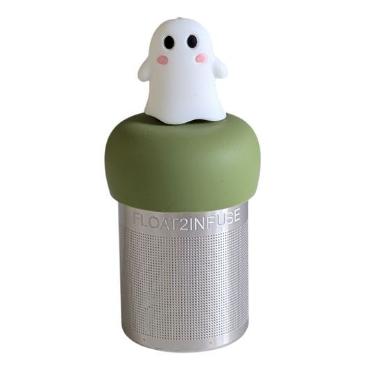 white ghost with cute pink cheeks tea infuser for loose leaf tea with a fine mesh stainless steel tea strainer 
that reads FLOAT2INFUSE on a green base with a white background