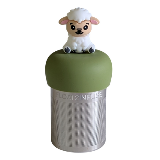 happy white sheep animal tea infuser for loose leaf tea with a fine mesh stainless steel tea strainer that reads FLOAT2INFUSE on a green base with a white background