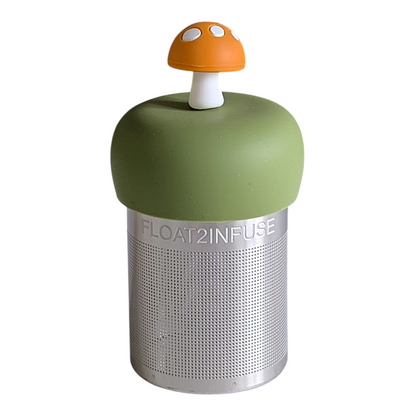 yellow mushroom tea infuser for loose leaf tea with a fine mesh stainless steel tea strainer that reads FLOAT2INFUSE on a green base with a white background